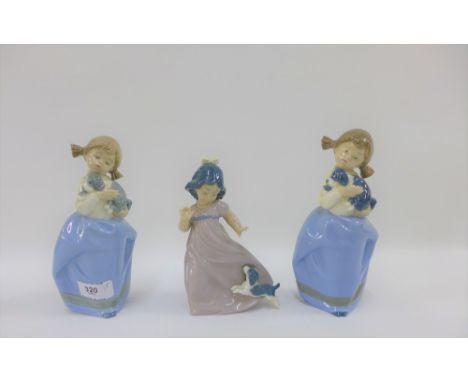 Three Nao figurines of girls with their puppy dogs, tallest 19cm (3) 