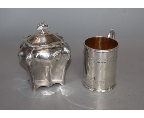 A Victorian engraved silver christening mug, Henry Holland, London, 1870 and an Edwardian silver tea caddy, Sheffield, 1902, 