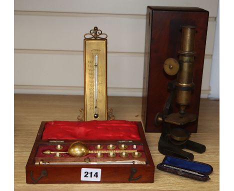 A cased microscope, a cased Sikes' hydrometer and two thermometers