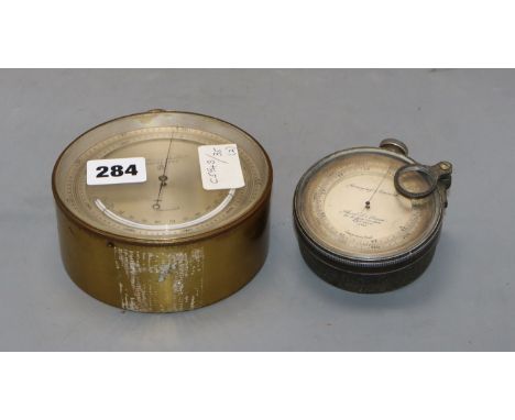 A Short &amp; Mason surveying aneroid precision barometer and a P. Casartelli aneroid barometer, diameter 8cm &amp; 12cm