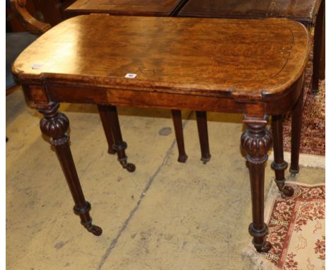 A Victorian walnut card table (one leg in need of restoration), W.96cm, D.52cm, H.75cm