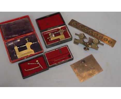 Various cased watchmakers tools