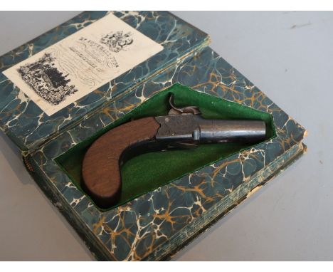 A 19th century boxlock percussion pistol concealed in a copy of 'Forty Five Guardsmen'CONDITION: The 'book' has general wear 