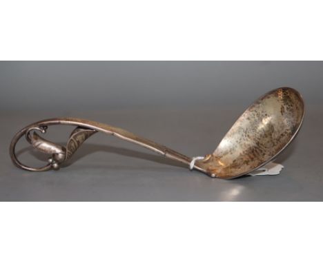 A 1920's Georg Jensen sterling silver 'leaf and berry' ladle, design no. 141, 18.8cm, 80 grams.CONDITION: Some tarnishing, ot