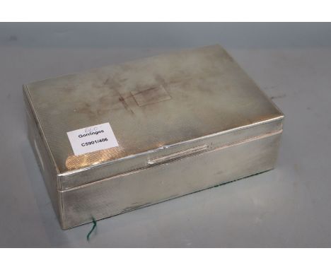 A 1930's engine turned silver mounted rectangular cigarette box, William Comyns &amp; Sons Ltd, London, 1936, 22.9cm, gross 3