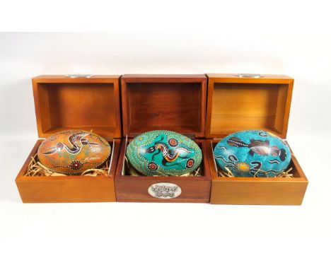 Three Wijikura emu eggs, painted with Australian Aboriginal art, signed, each boxed with C of A's, approx. 14cm (3)Condition 