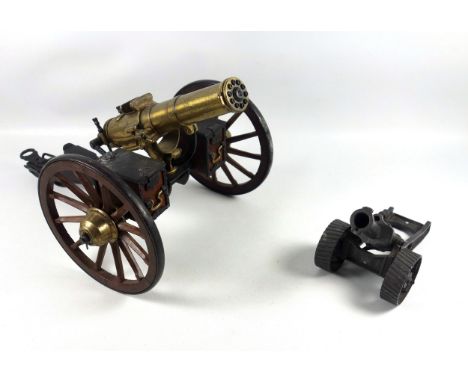 Desktop model of a Gatling field gun, the brass barrel with turning mechanism mimicking firing action, set on a painted carri