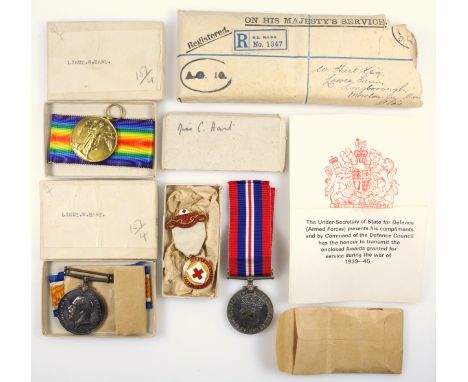 Pair of George V War and Victory medals award to Lt. W Hart, his Defence medal, 1945, with ribbons, 2 boxes and an envelope; 