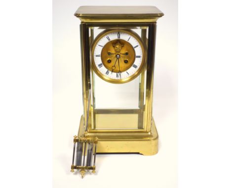 Late 19th century 4-glass clock with a gilt circular dial with visible escapement, white enamelled chapter ring, black Roman 