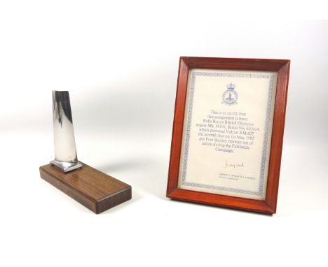 A turbine blade from the engine of a Falklands War Vulcan, XM607, used in Operation Black Buck, 14.5cm, mounted on a wooden b