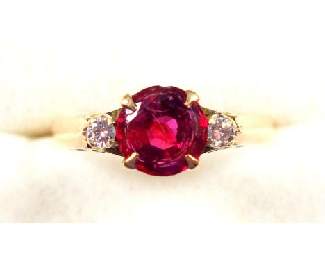 Yellow metal ring set ruby and 2 diamonds, stamped "14K" and "Alex", gross 2.9grs (chip, scratches and cracks to ruby) 