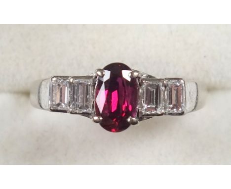 White metal ring set heat treated ruby and 4 baguette diamonds, stamped 585, gross 3.3grs, size L 1/2