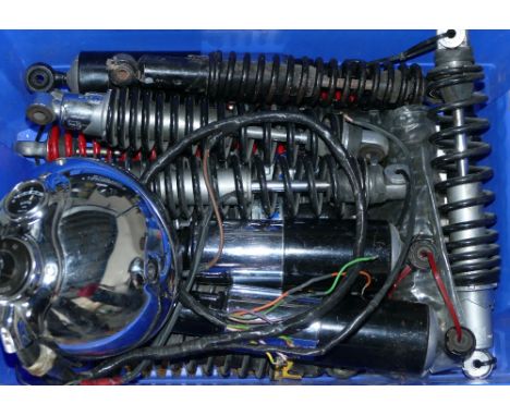Various rear shock absorbers and a Miller headlamp.