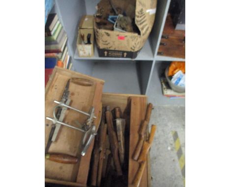 A wooden tool chest containing various wooden woodworking tools to include various planes and shavers, along with a Record 04
