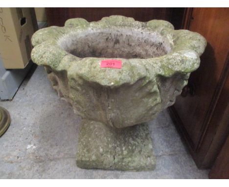 A composition stoneware garden planter raised on a square formed base 44cm h x 51 cm w 