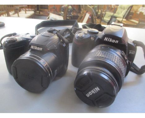 A Nikon D40 camera together with a Nikon Coolpix L310 
