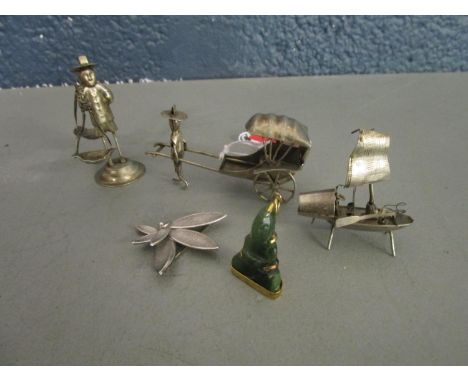 A group of Chinese white metal figurines, a Chinese junk, a 800 silver brooch and a gilded white metal carved jade pendant Bu