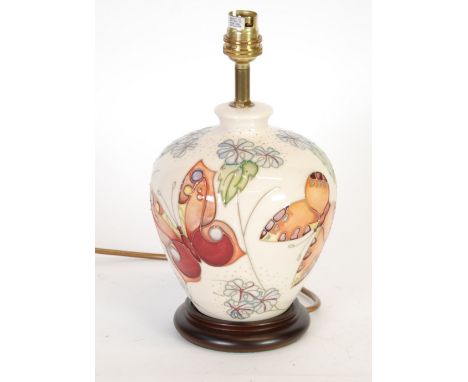 MODERN MOORCROFT TUBE LINED POTTERY TABLE LAMP BASE of ovoid form, painted in colours with butterflies and flowers, on an off