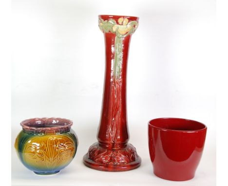 BURMANTOFT'S, ART NOUVEAU MOULDED POTTERY JARDINIERE STAND, of slightly waisted form, painted in tones of green and yellow wi