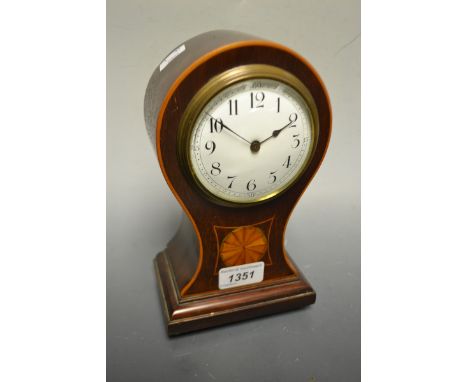 An Edwardian mahogany inlaid balloon shaped mantel clock, white dial, Arabic numerals, stepped base, four brass bun feet, 22c
