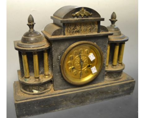 A late 19th century French architectural slate mantel clock, embossed brass dial, Arabic numerals, twin winding holes, 35cm h