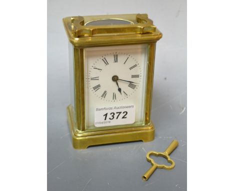A French lacquered brass five glass carriage timepiece, rectangular 5cm enamel dial inscribed with Roman numerals, platform e