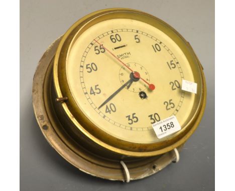A brass Smith Astral port hole clock, Arabic numerals, 26cm diam.