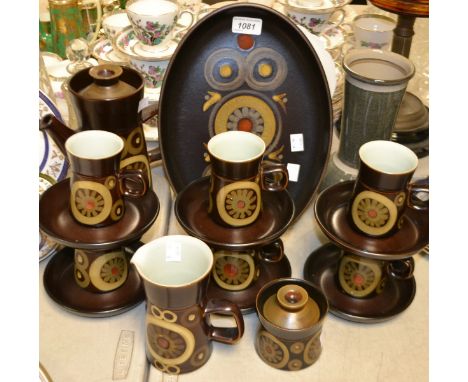 A Denby Arabesque pattern coffee pot, six coffee cups and saucers, cream jug, sucrier and cover, oval plate