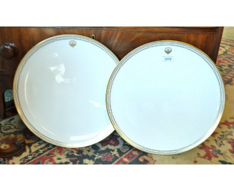A pair of Royal Worcester chargers printed in gold on a white ground, For the State of Kuwait, 41cm diam, printed marks in go
