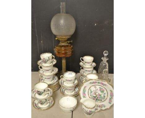 A Victorian amber glass and gilt metal oil lamp;a decanter,others smaller;an Indian tree pattern part tea service ;qty.