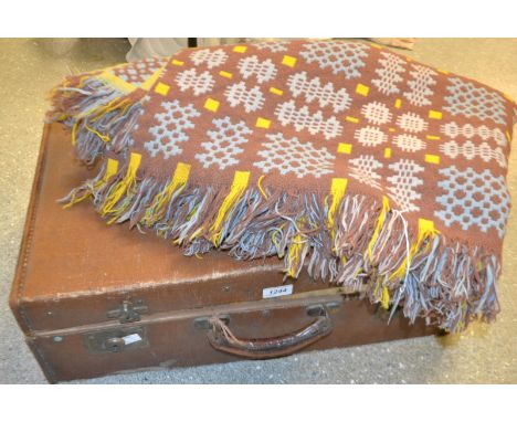 Textiles - a Welsh tapestry blanket, in shades of brown, blue and yellow; a 1940s brown leather suitcase (2)