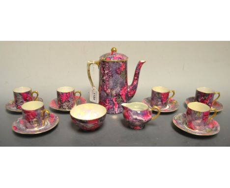 A Czechoslovakian coffee service with  luster interior comprising coffee pot, creamer, sugar bowl, demitasse cups and saucers