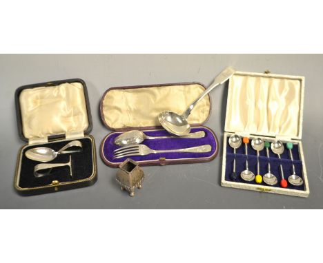 A George IV silver sauce ladle, London; a Victorian silver christening set, Sheffield 1876, cased; a silver baby's feeding se