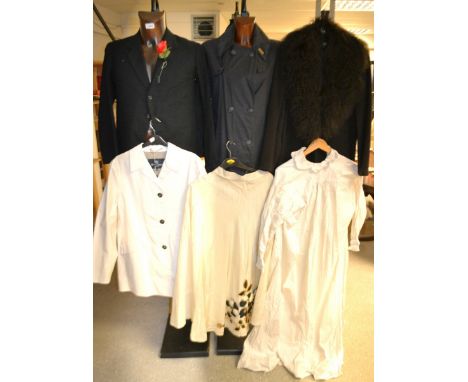 A lady's Barbour waxed trench coat, size 12;  an Aquascutum cream Perrygate Raincoat, with tags, size 12;  an M&S black coat,