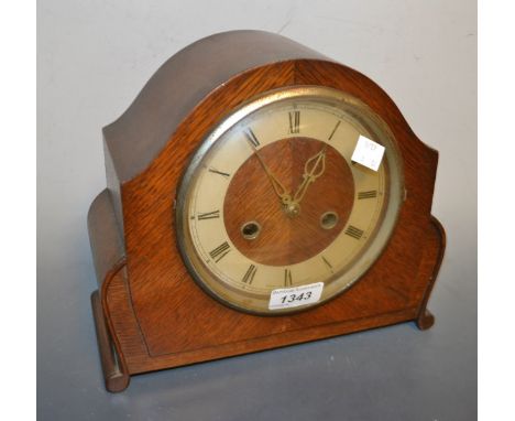 A 1920's oak case mantel clock, Roman numerals, twin winding holes