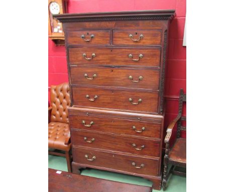 A Georgian mahogany chest on chest with blind fret canted corners, two short over three long drawer top and brushing slide ov