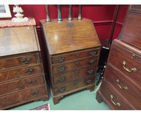 A Georgian oak four drawer bureau of slim proportions on bracket feet, with key, fitted interior, 100cm high x 64cm wide x 50