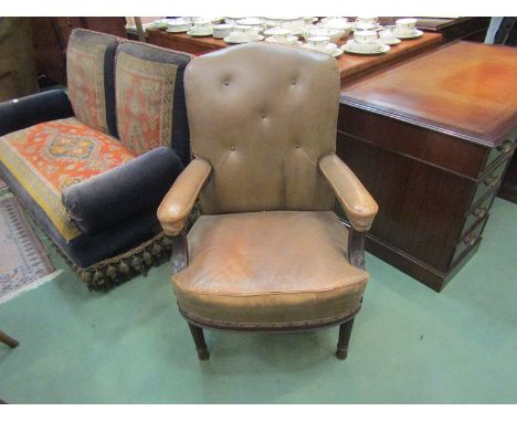A pair of Victorian club style elbow chairs on melon fluted legs with leather button back and studded upholstery, 104cm high 