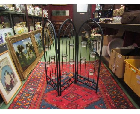 A folding wrought iron tea-light holder and a pair of wall  candle sconces