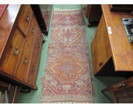 A tribal handwoven kilim runner, strip design and tasselled ends, 88cm long x 68cm wide
