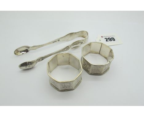A Pair of Hallmarked Silver Napkin Rings, engraved "H Birch" and "M Birch"; together with a pair of hallmarked silver sugar t