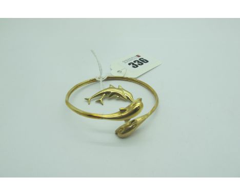 A Modern Dolphin Torque Style Bangle, stamped "585" (12grams), together with similar Dolphin brooch, indistinctly stamped "37