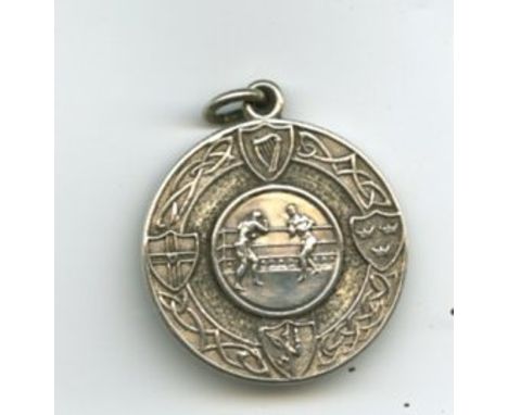 Medal: Boxing, a circular silver Medal, the obverse with Celtic design and Provincial Arms, the centre with a depiction of tw