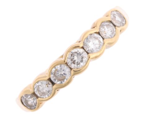 An 18ct gold seven stone diamond half hoop ring, maker KC, London 2007, set with modern round brilliant-cut diamonds, total d