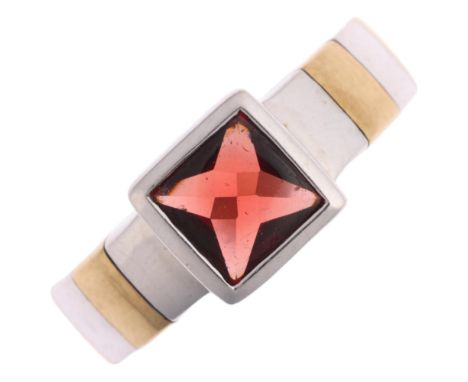 A 9ct two-colour gold single stone garnet ring, maker GC, Birmingham 1999, setting height 7.7mm, size N, 4.5g Condition Repor