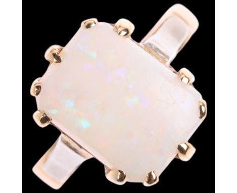 An 18ct gold synthetic opal dress ring, Birmingham 1900, claw set with rectangular cabochon opal, setting height 13.7mm, size