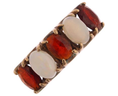 A 9ct gold five stone opal and garnet half hoop ring, maker W&G, Birmingham 1975, setting height 6.8mm, size N, 2.5g Conditio