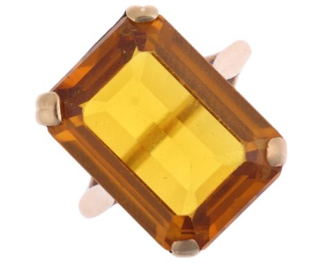 A 9ct gold citrine dress ring, claw set with rectangular step-cut citrine, setting height 18mm, size O, 6.2g Condition Report