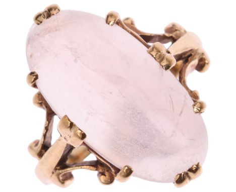 A 9ct gold rose quartz dress ring, maker MVM, Birmingham 1967, claw set with long oval cabochon rose quartz, setting height 1