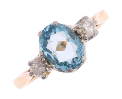 An 18ct gold three stone blue topaz and diamond ring, platinum-topped set with oval mixed-cut topaz and round-cut diamonds, t